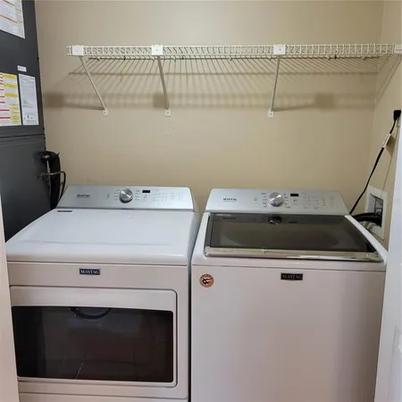 a utility room with dryer and washer