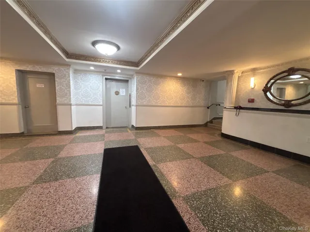 a view of a kitchen with a sink and a window