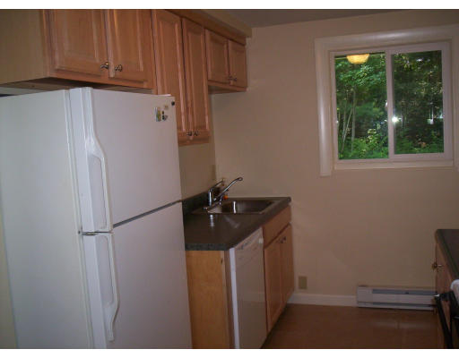 79 Rindone Street Holbrook, MA 02343 - Photo 8 of 10 a kitchen with stainless steel appliances a refrigerator and a sink