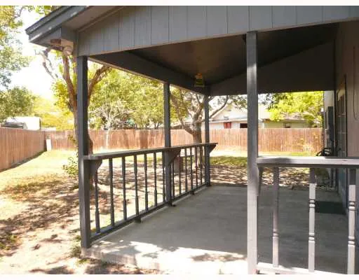 a view of a porch with a floor to ceiling window
