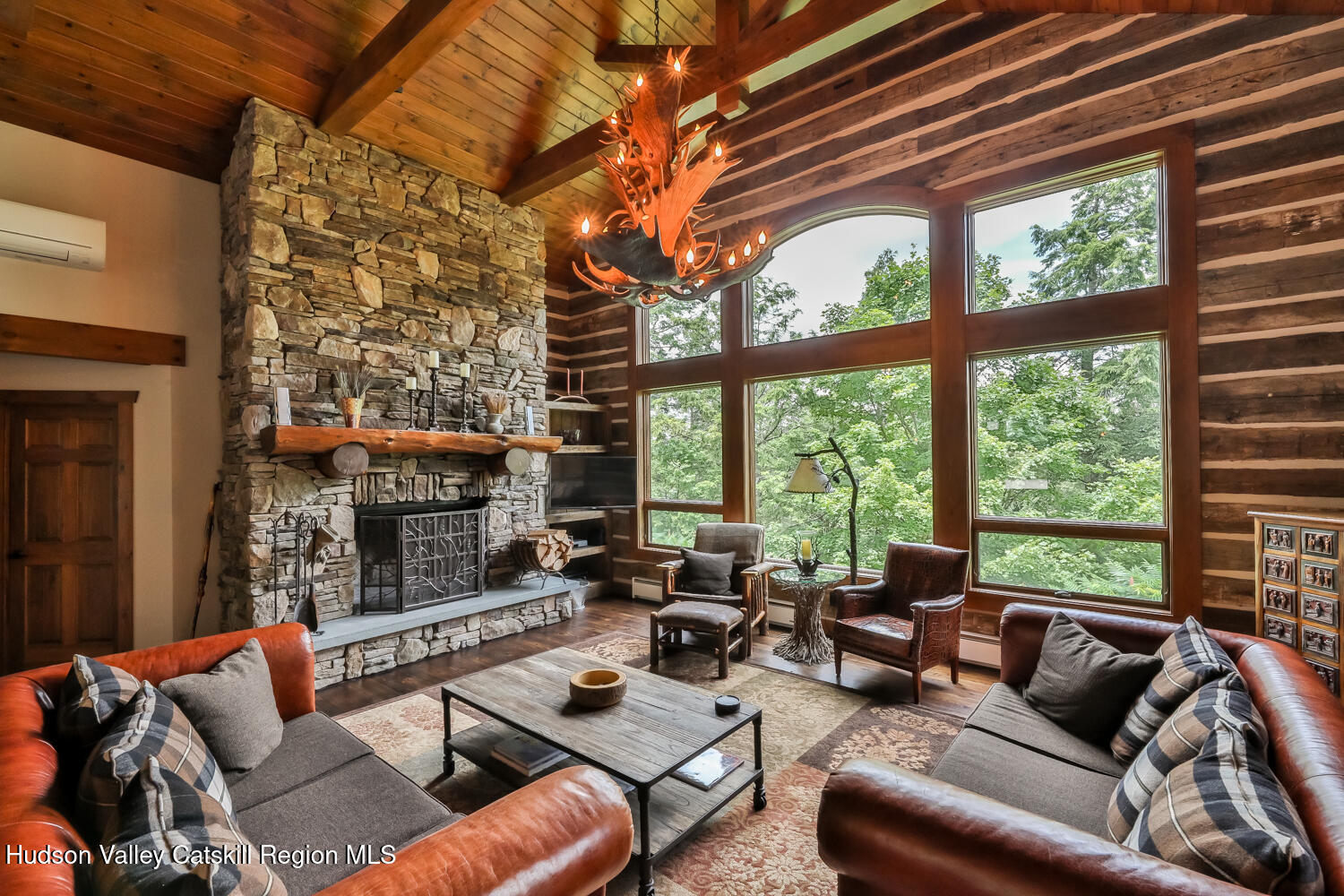 22 Club Road Windham, NY 12496 - Photo 13 of 41 a living room with furniture and a large window