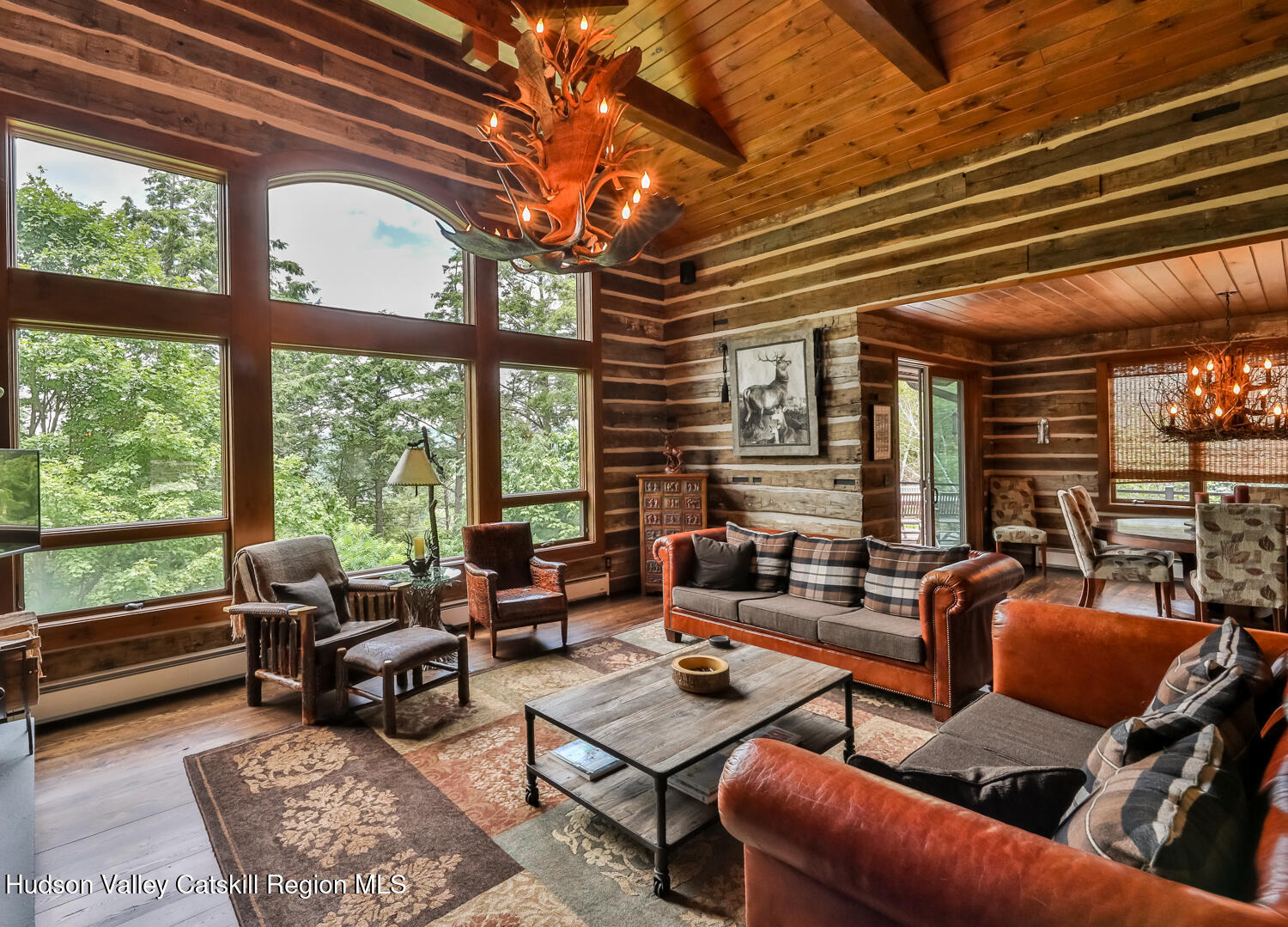 22 Club Road Windham, NY 12496 - Photo 14 of 41 a living room with furniture and a large window