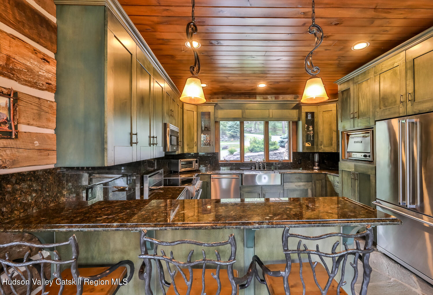 22 Club Road Windham, NY 12496 - Photo 17 of 41 a kitchen with stainless steel appliances granite countertop a stove and a refrigerator