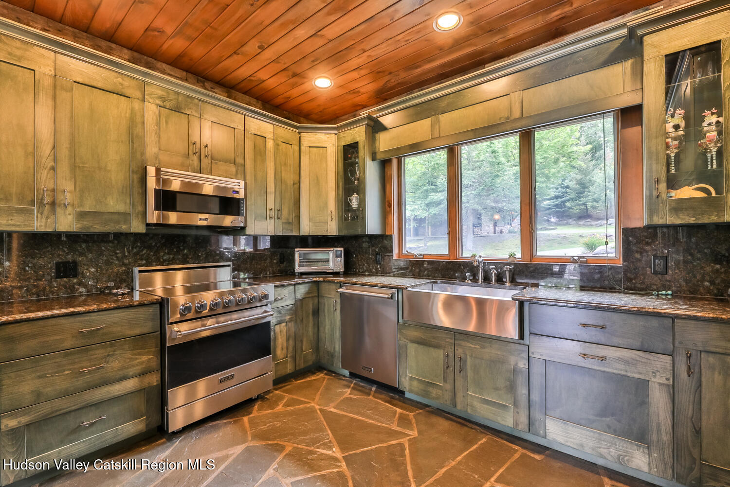 22 Club Road Windham, NY 12496 - Photo 18 of 41 a kitchen with stainless steel appliances granite countertop a stove sink microwave and cabinets
