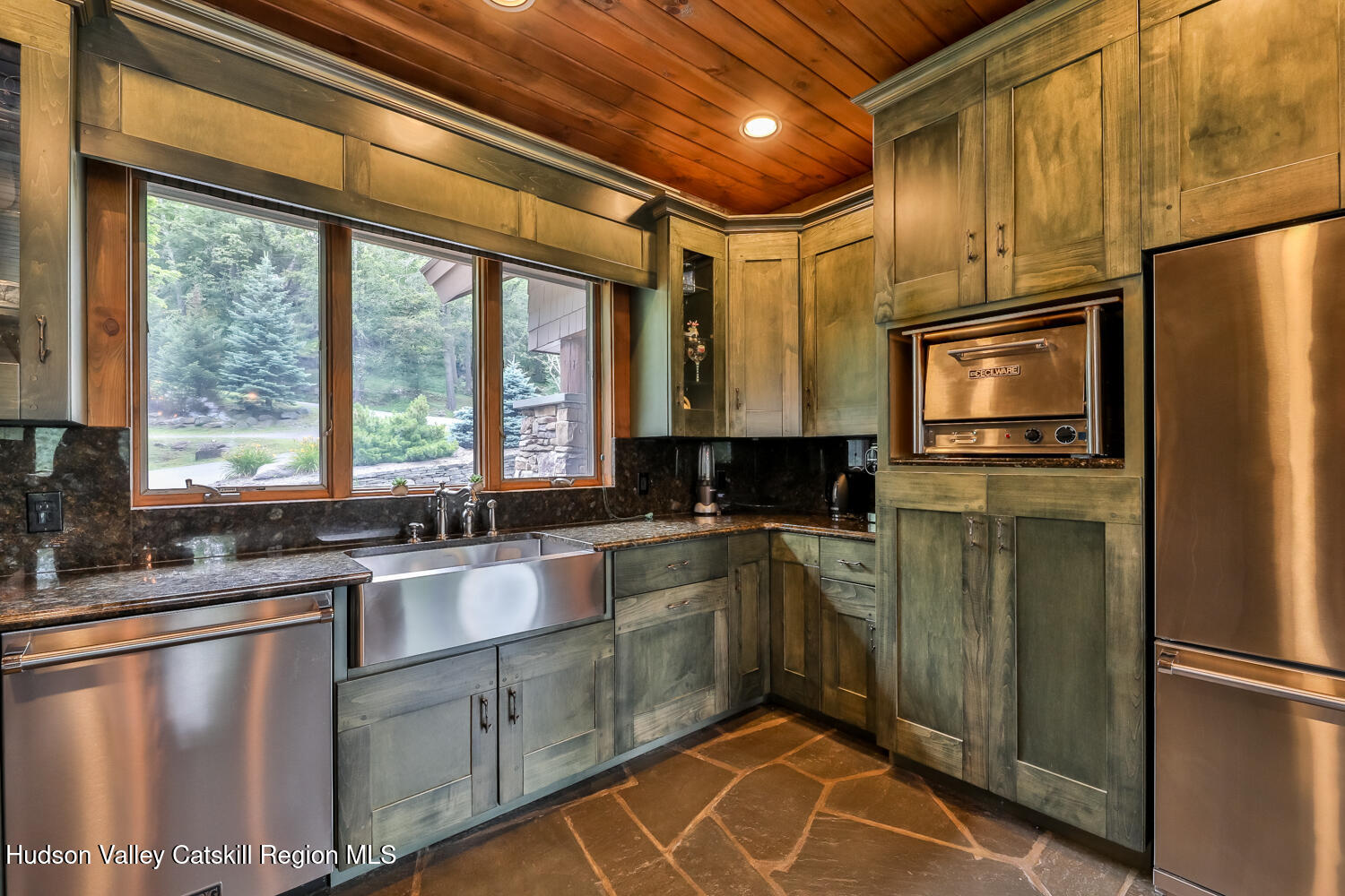 22 Club Road Windham, NY 12496 - Photo 19 of 41 a kitchen with a refrigerator a sink and cabinets