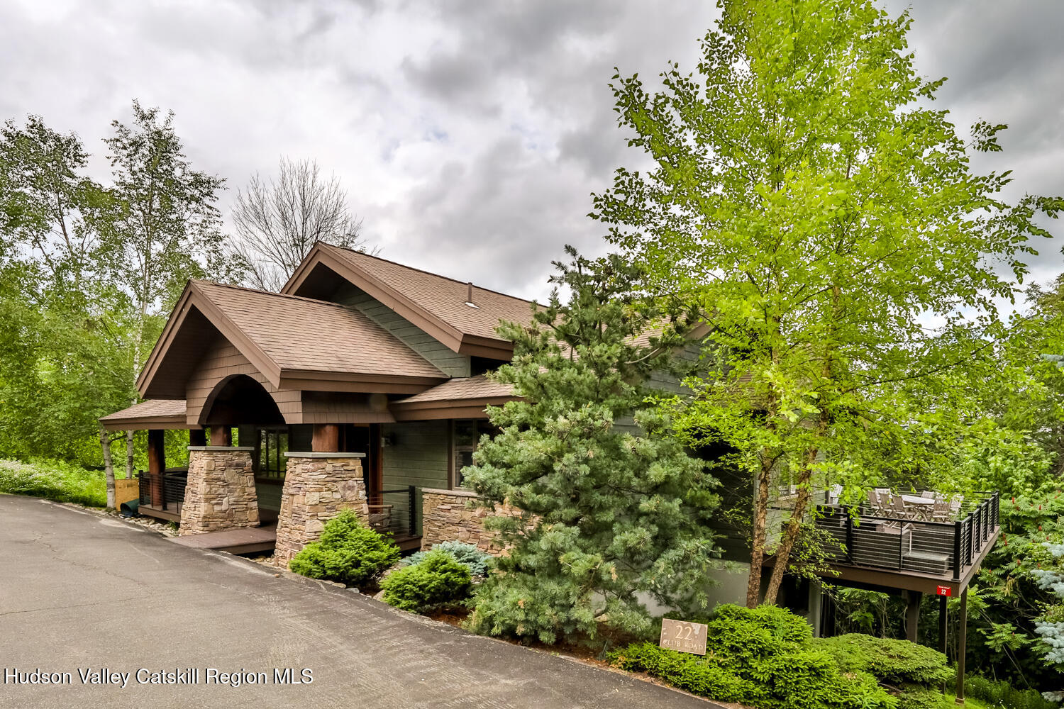 22 Club Road Windham, NY 12496 - Photo 2 of 41 a view of a house with brick walls and a tree