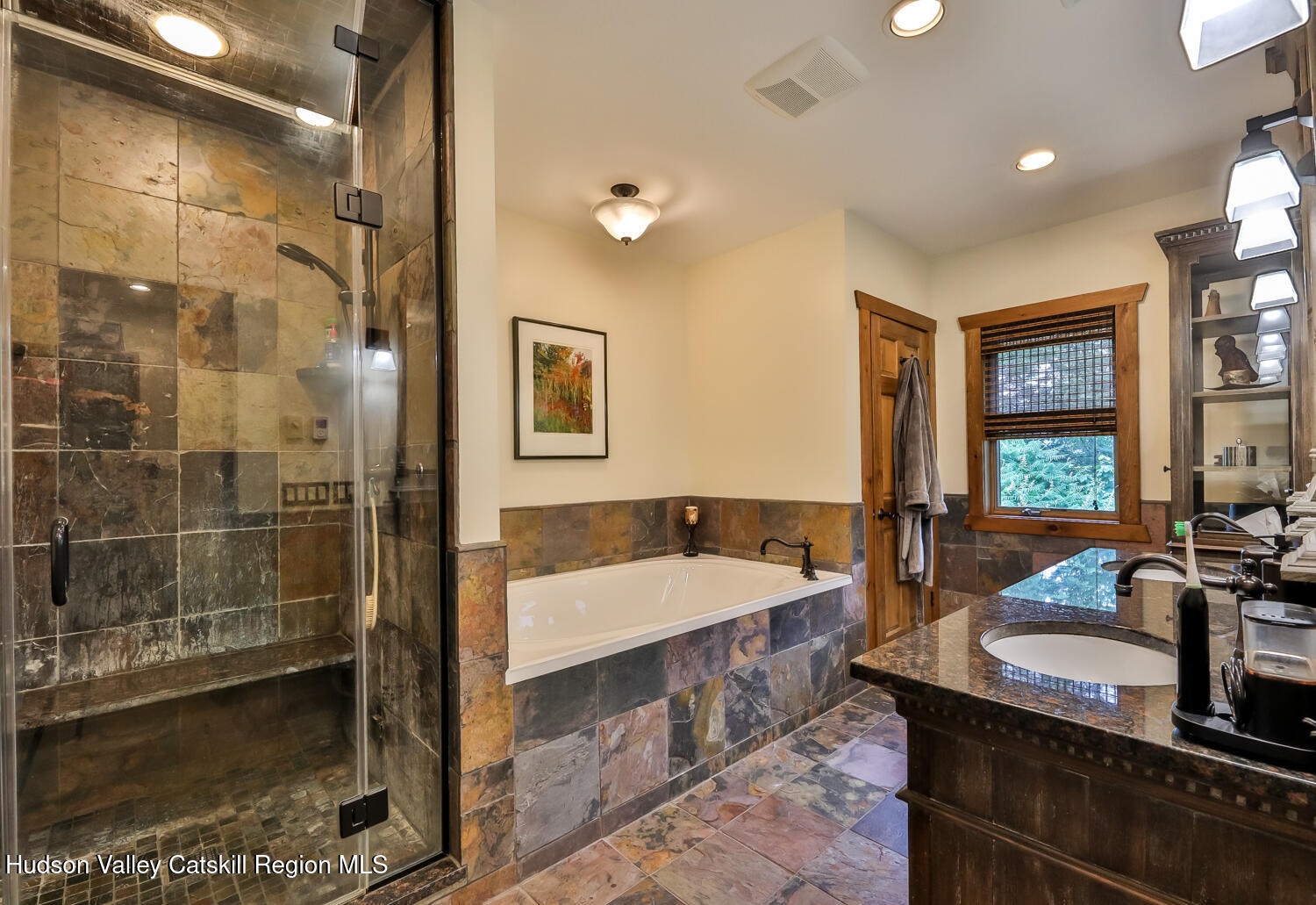 22 Club Road Windham, NY 12496 - Photo 26 of 41 a spacious bathroom with a tub a sink and mirror