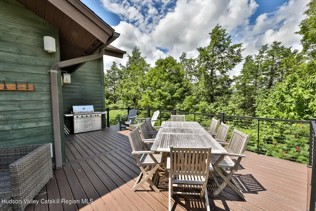 a view of balcony with seating space and trees