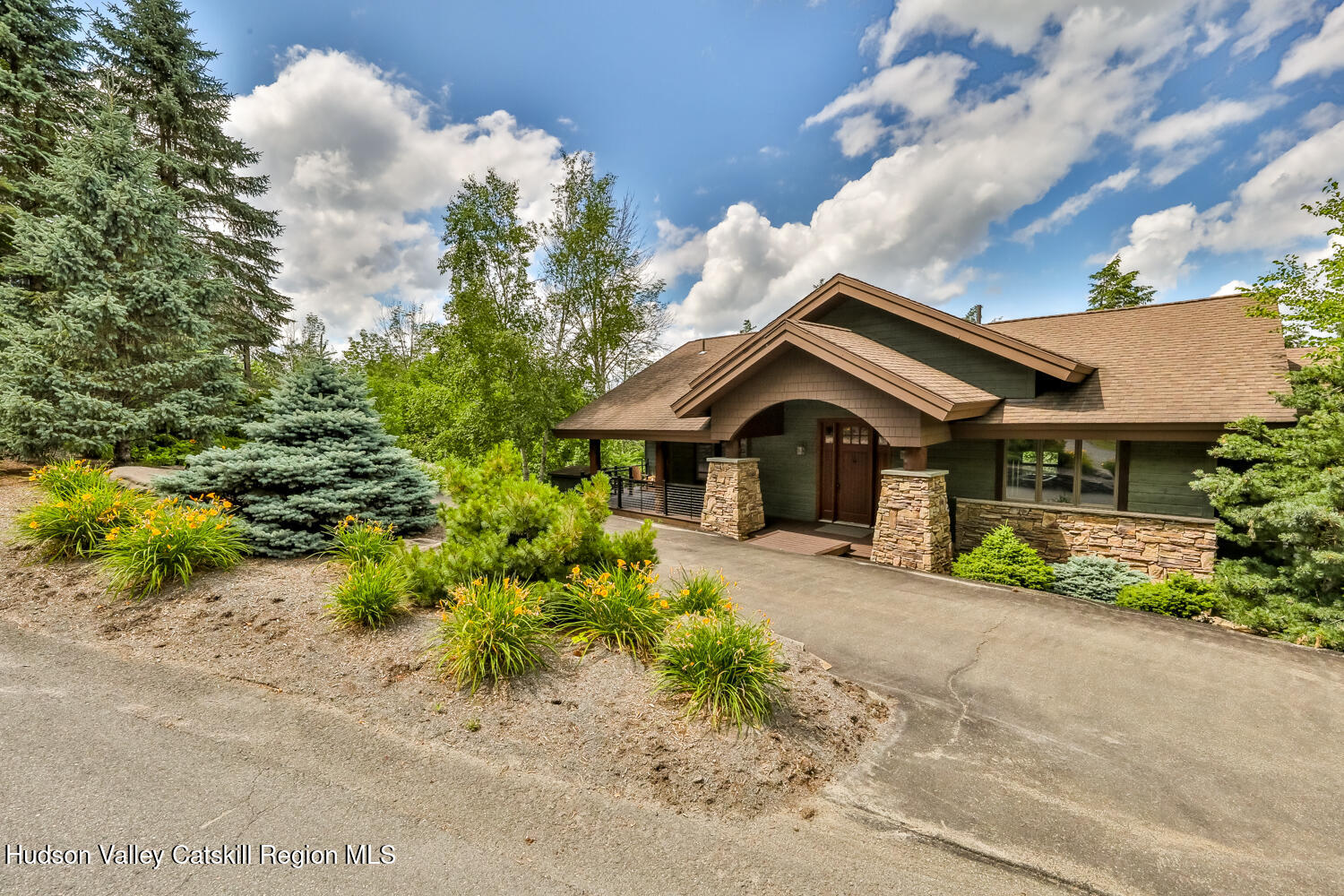 22 Club Road Windham, NY 12496 - Photo 3 of 41 a front view of a house with a yard and garage