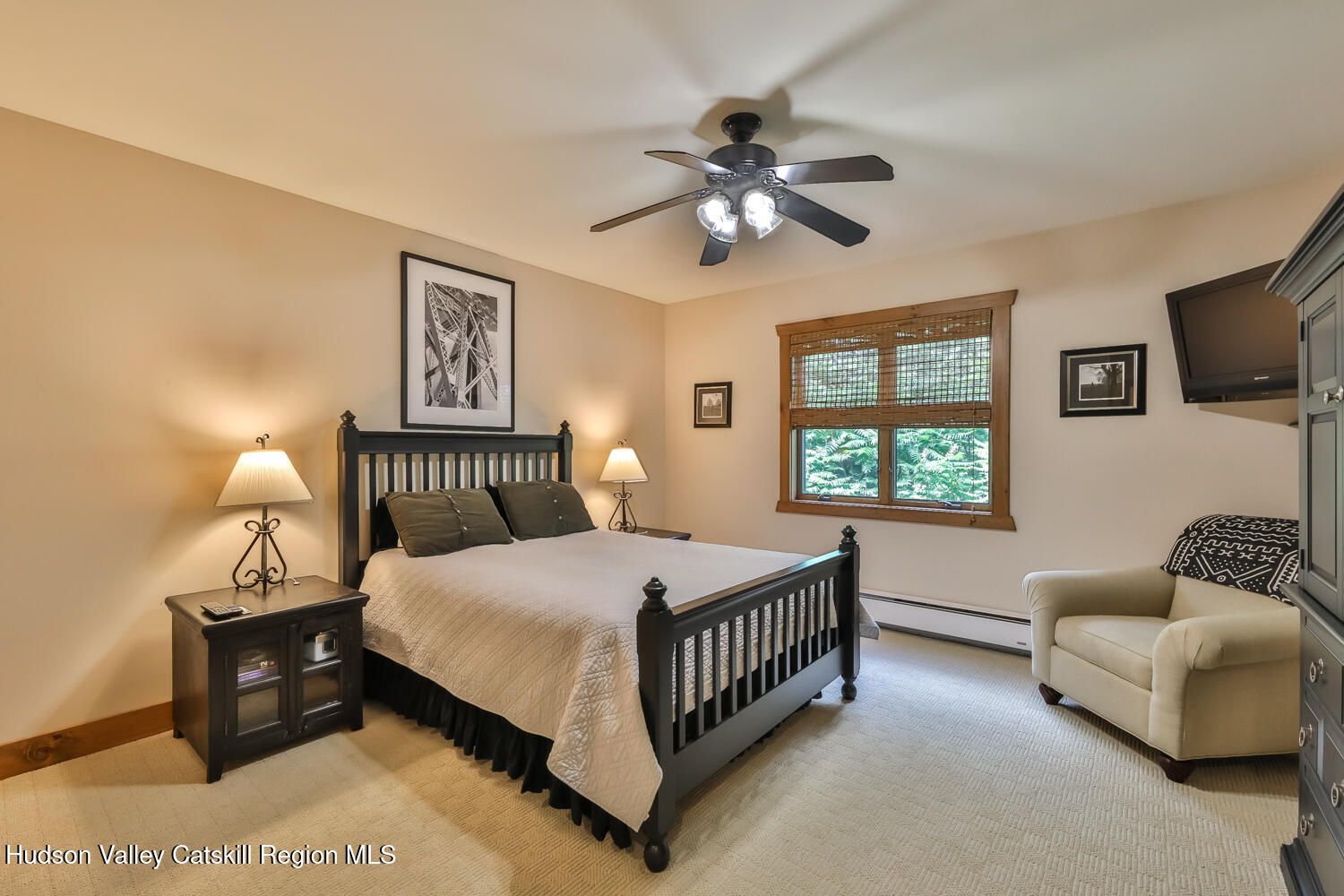 22 Club Road Windham, NY 12496 - Photo 38 of 41 a bedroom with a bed couch and a window