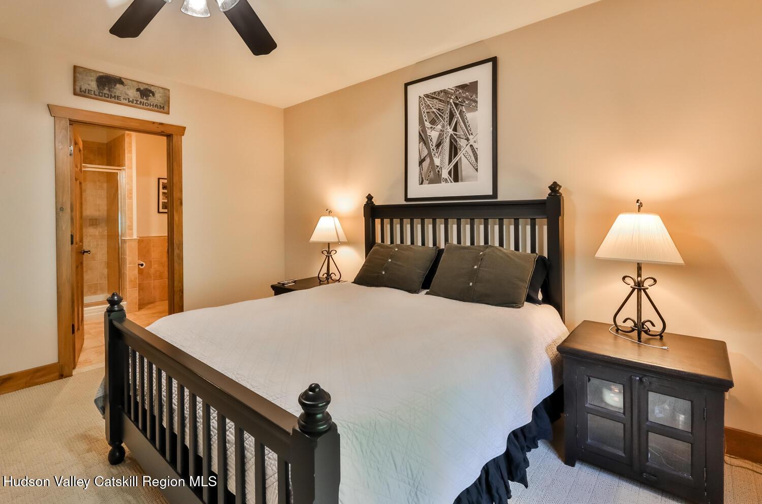 22 Club Road Windham, NY 12496 - Photo 39 of 41 a bedroom with a bed and a chandelier