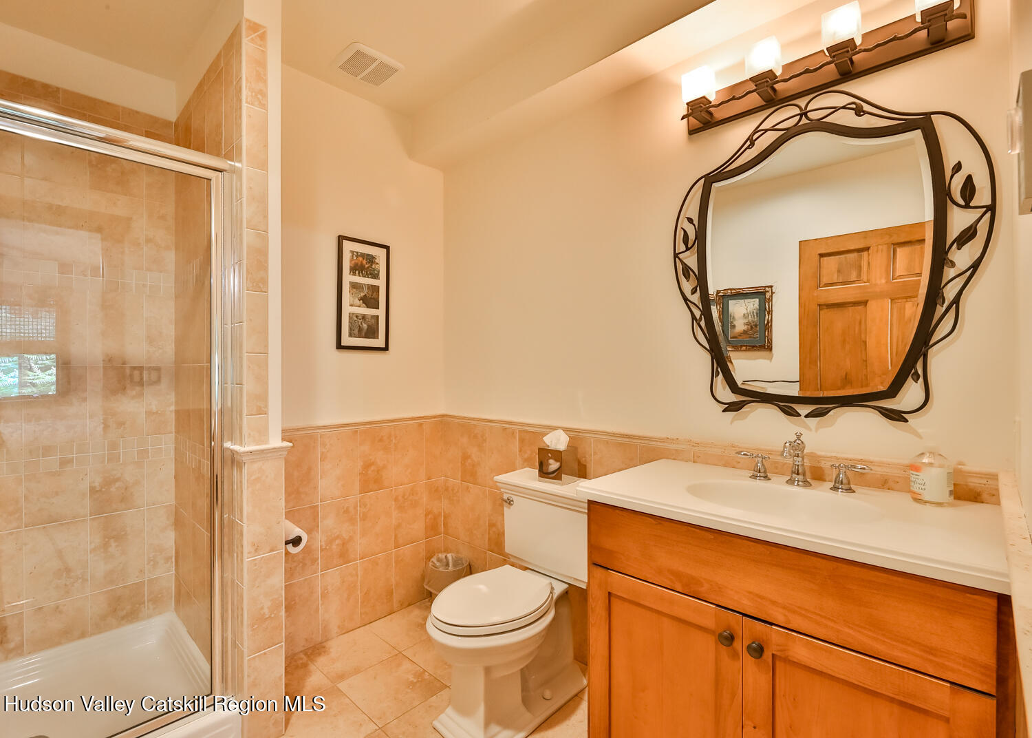 22 Club Road Windham, NY 12496 - Photo 40 of 41 a bathroom with a sink mirror and toilet