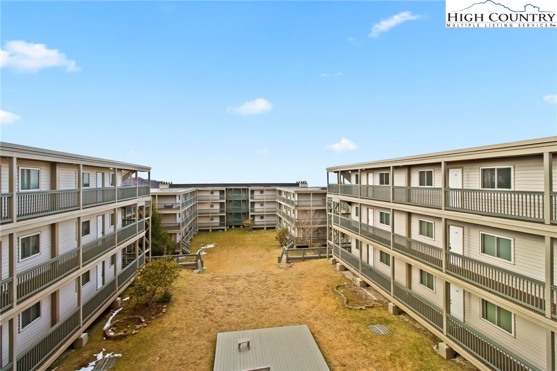 a view of a swimming pool with an outdoor seating