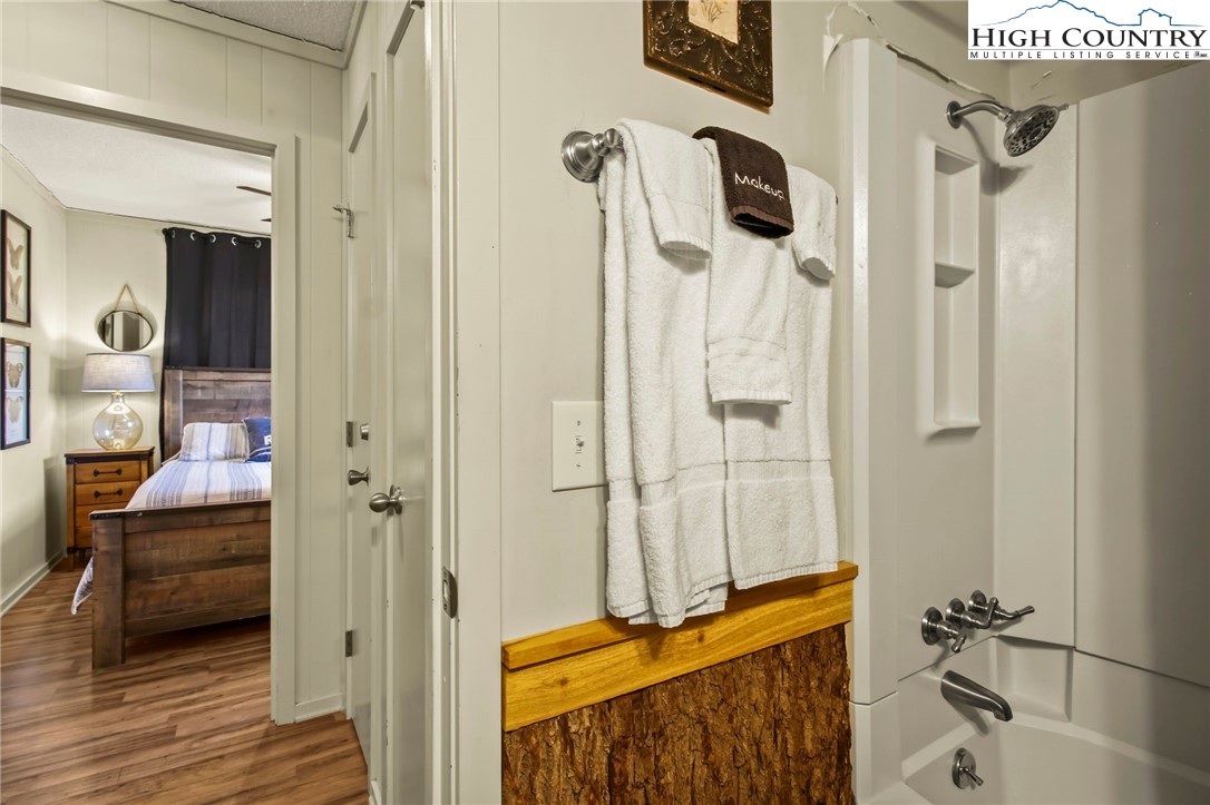 301 Pinnacle Inn Road, Unit 3301 Beech Mountain, NC 28604 - Photo 12 of 18 a bathroom with a tub and shower