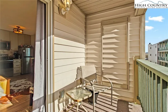 a view of a balcony with wooden floor