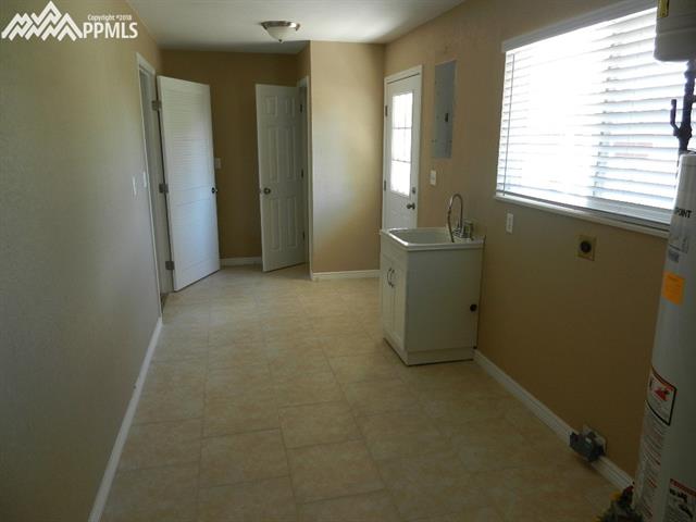 16555 Bar X Road Colorado Springs, CO 80908 - Photo 22 of 36 The laundry room (mud room) has it's own entry closet.