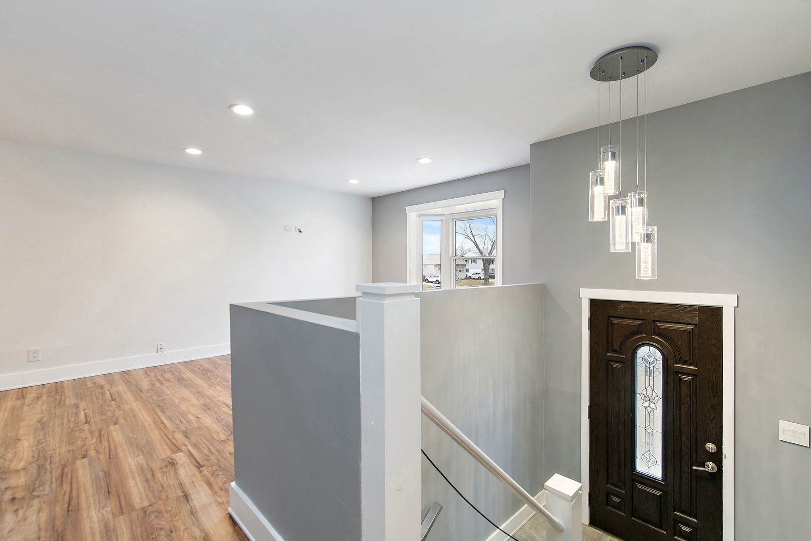 1014 Vine Street Streamwood, IL 60107 - Photo 2 of 23 wooden floor in an empty room with a window