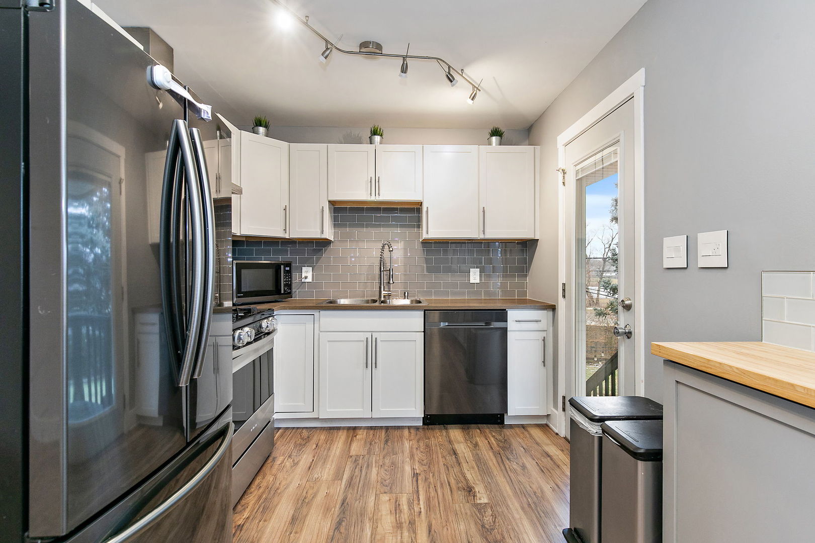 1014 Vine Street Streamwood, IL 60107 - Photo 6 of 23 a kitchen with a refrigerator and a sink