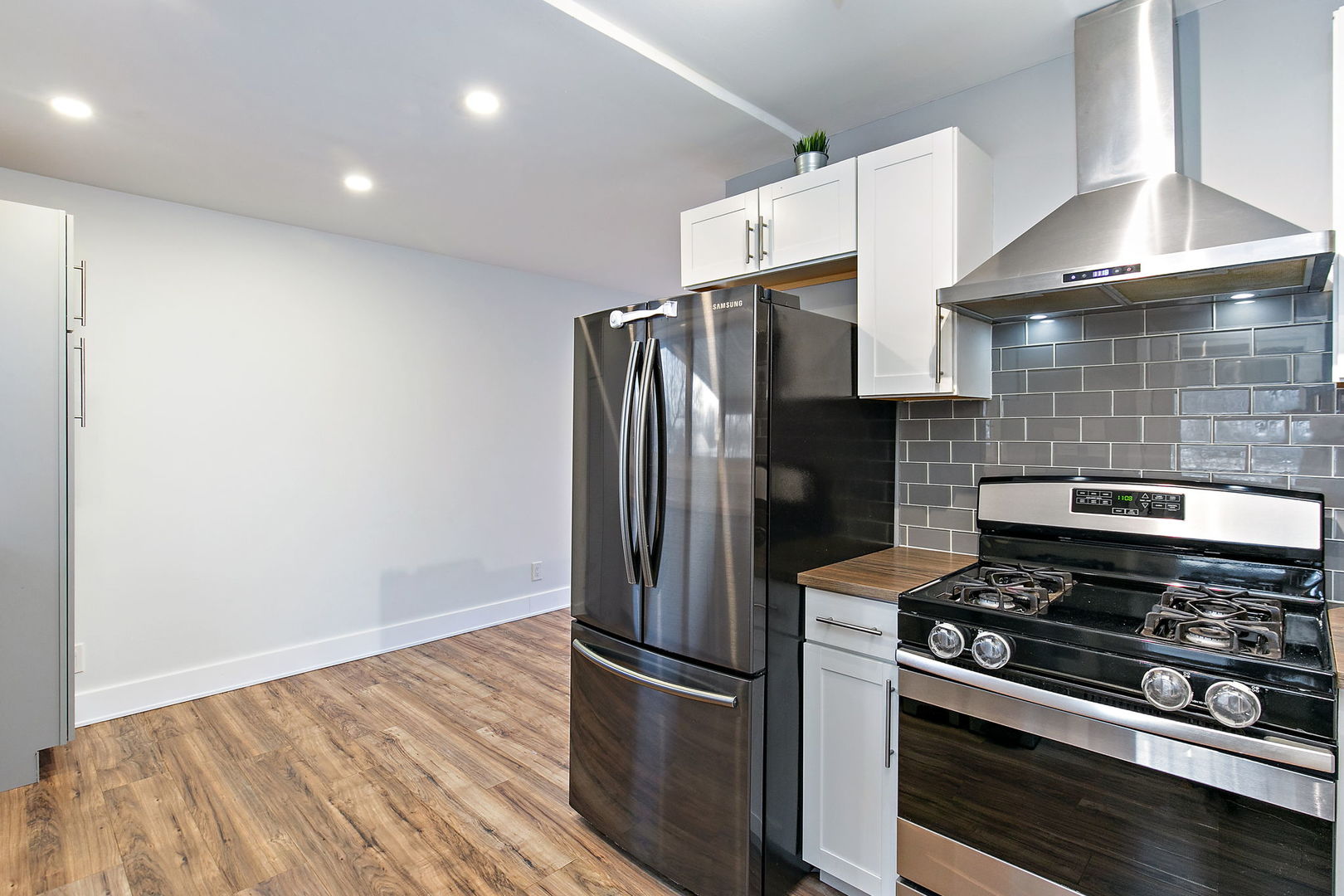 1014 Vine Street Streamwood, IL 60107 - Photo 8 of 23 a kitchen with stainless steel appliances granite countertop a refrigerator and a stove