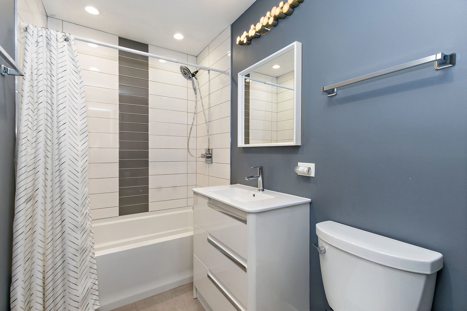 1014 Vine Street Streamwood, IL 60107 - Photo 9 of 23 a bathroom with a sink toilet and shower