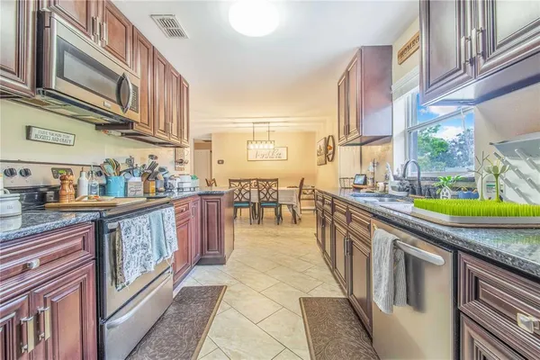 a kitchen with stainless steel appliances granite countertop lots of counter top space