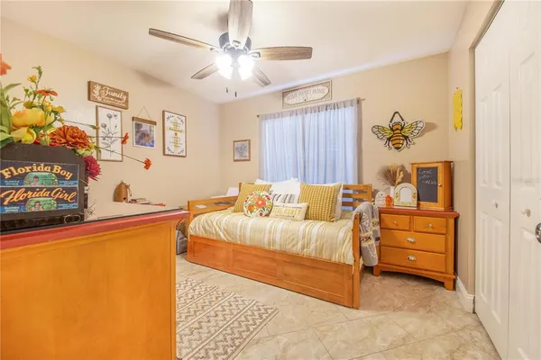 a bed room with a bed and a chandelier