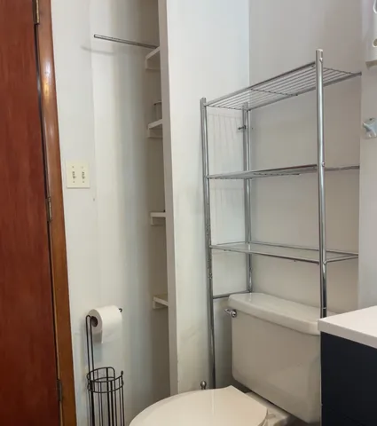 a bathroom with a shower and toilet