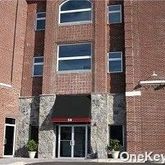 a view of building with a window and a door