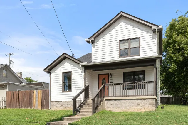 a front view of a house with a porch
