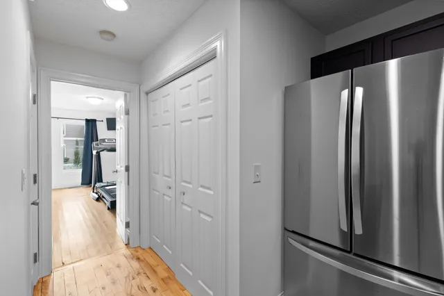 a view of a bathroom with a tub shower and mirror