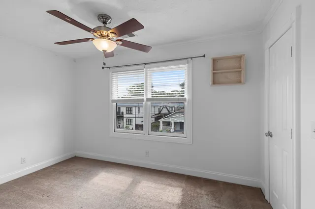 a view of an empty room with a window