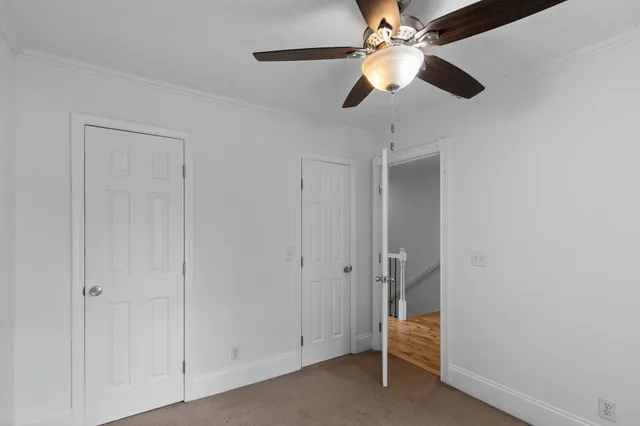 a view of room with ceiling fan