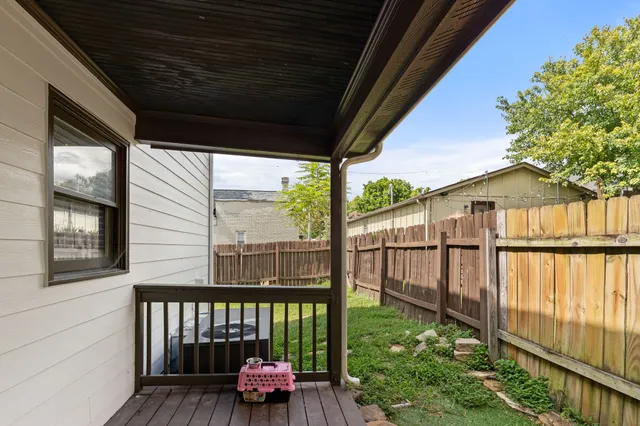 a view of a porch with wooden floor