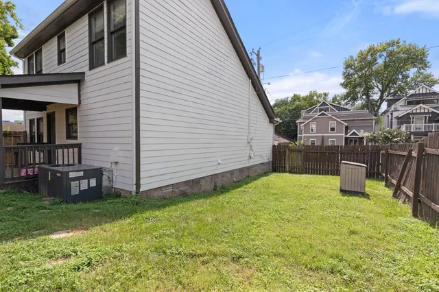 a view of a backyard with plants and a patio