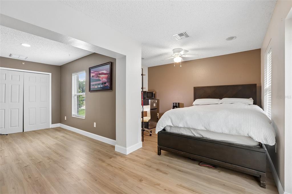 1525 Kestrel Way Brandon, FL 33511 - Photo 19 of 48 a bedroom with a bed and a ceiling fan