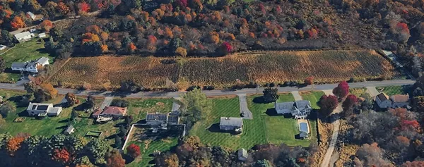 an aerial view of residential house with outdoor space