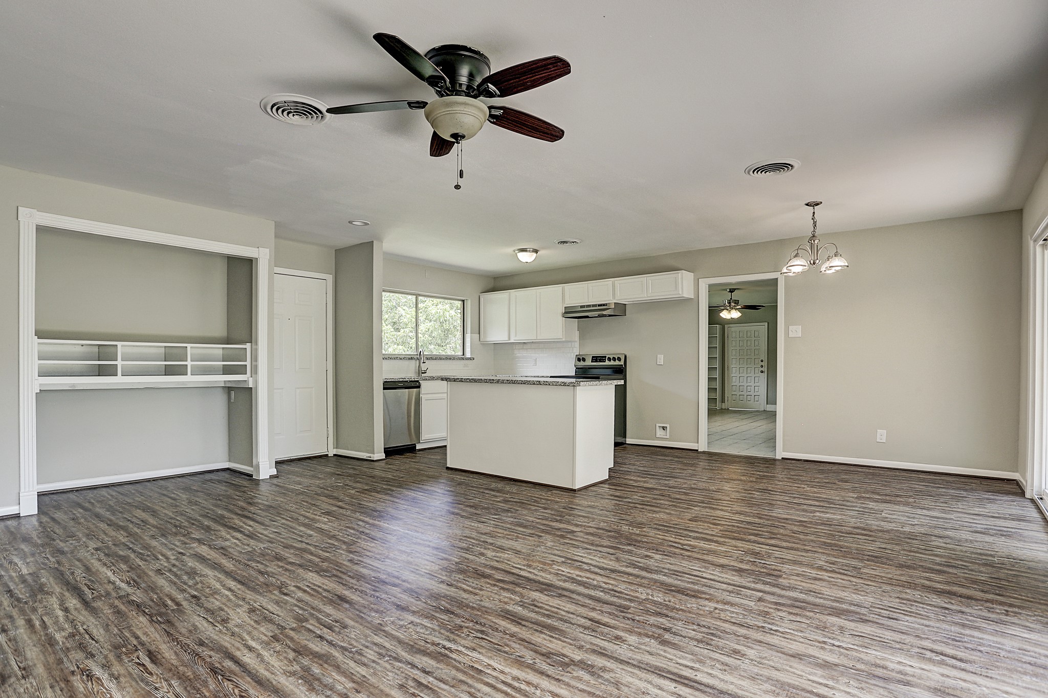 1803 Jones Street Rosenberg, TX 77471 - Photo 4 of 11 a view of kitchen with granite countertop cabinets and refrigerator