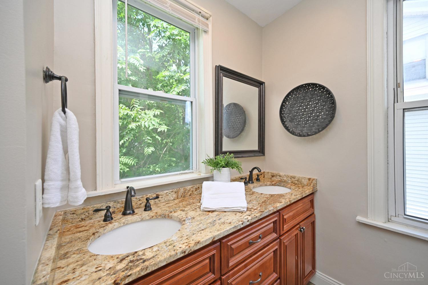 3422 Brotherton Road Cincinnati, OH 45209 - Photo 23 of 36 The primary bathroom has a dual vanity.