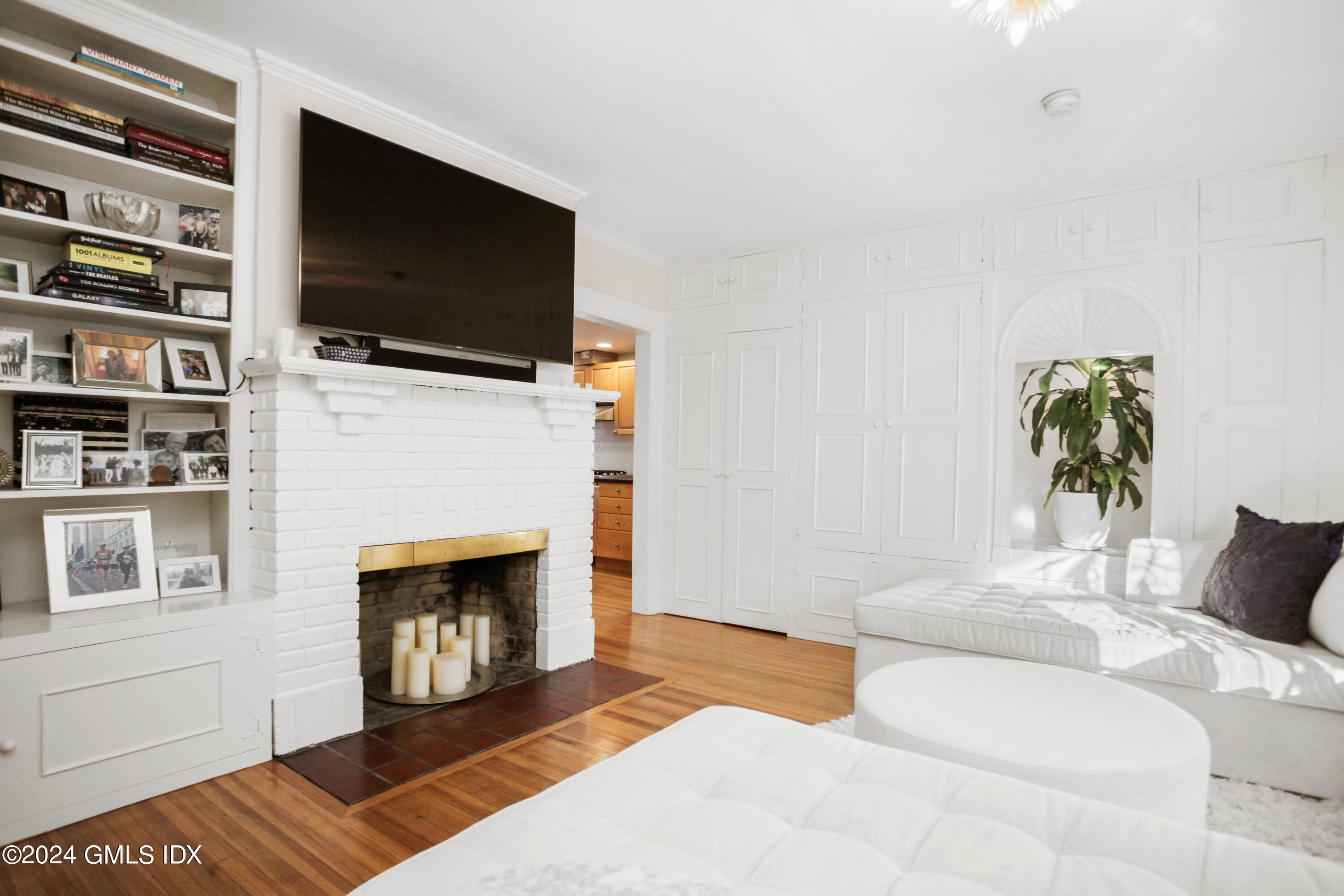 18 Shore Road Old Greenwich, CT 06870 - Photo 11 of 51 a living room with furniture and a fireplace