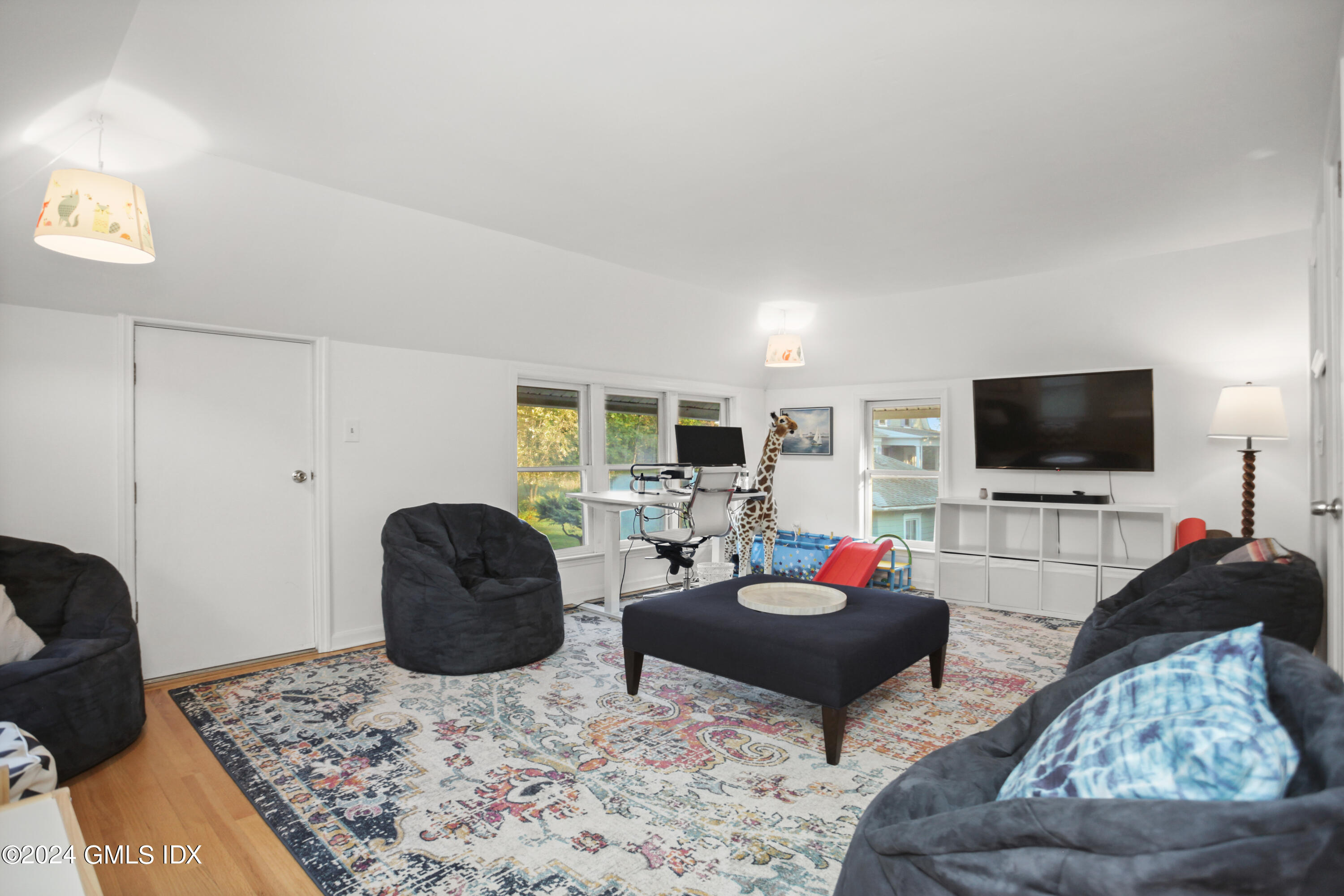 18 Shore Road Old Greenwich, CT 06870 - Photo 22 of 51 a living room with furniture and a flat screen tv