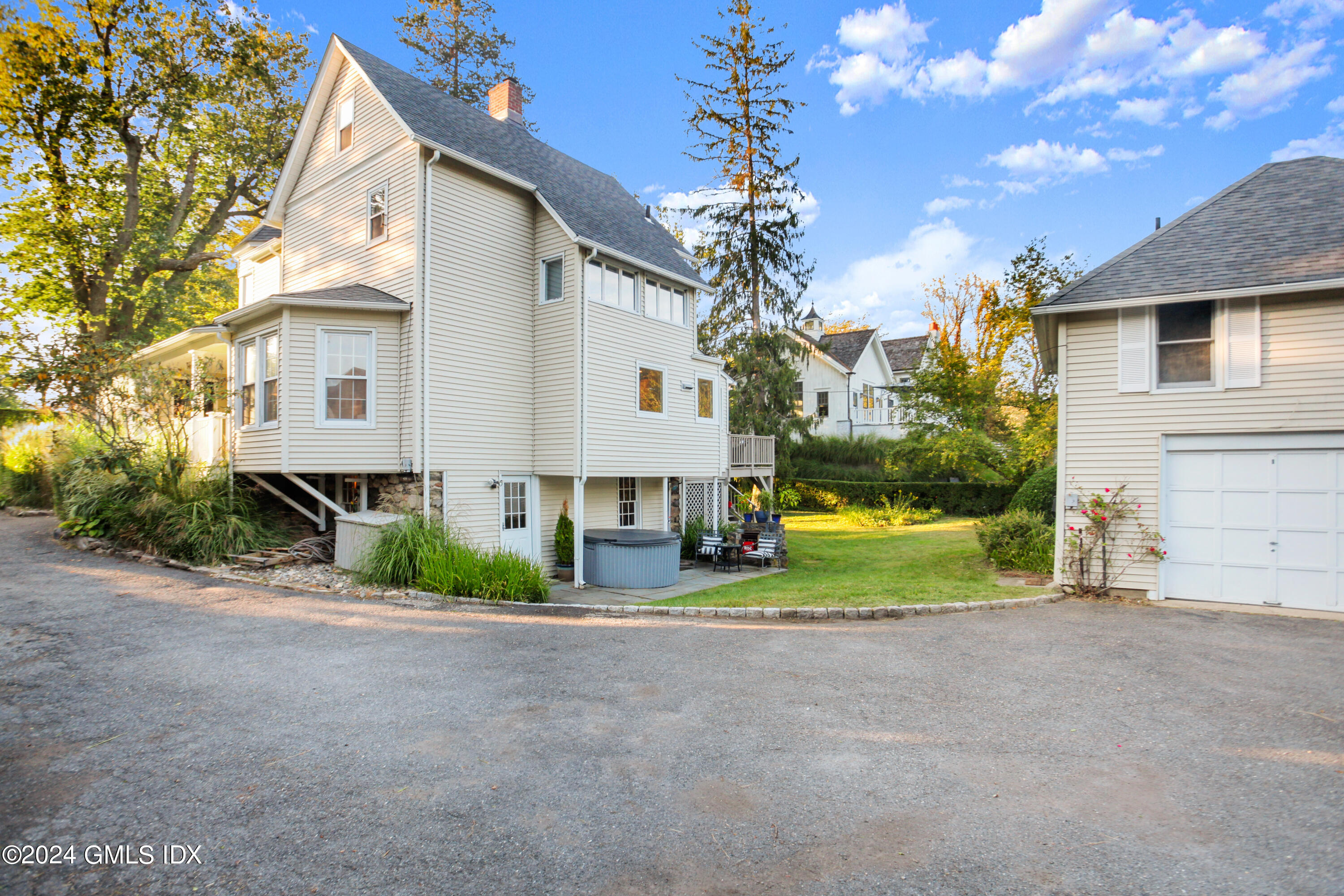 18 Shore Road Old Greenwich, CT 06870 - Photo 26 of 51 a view of a big house with a big yard and plants