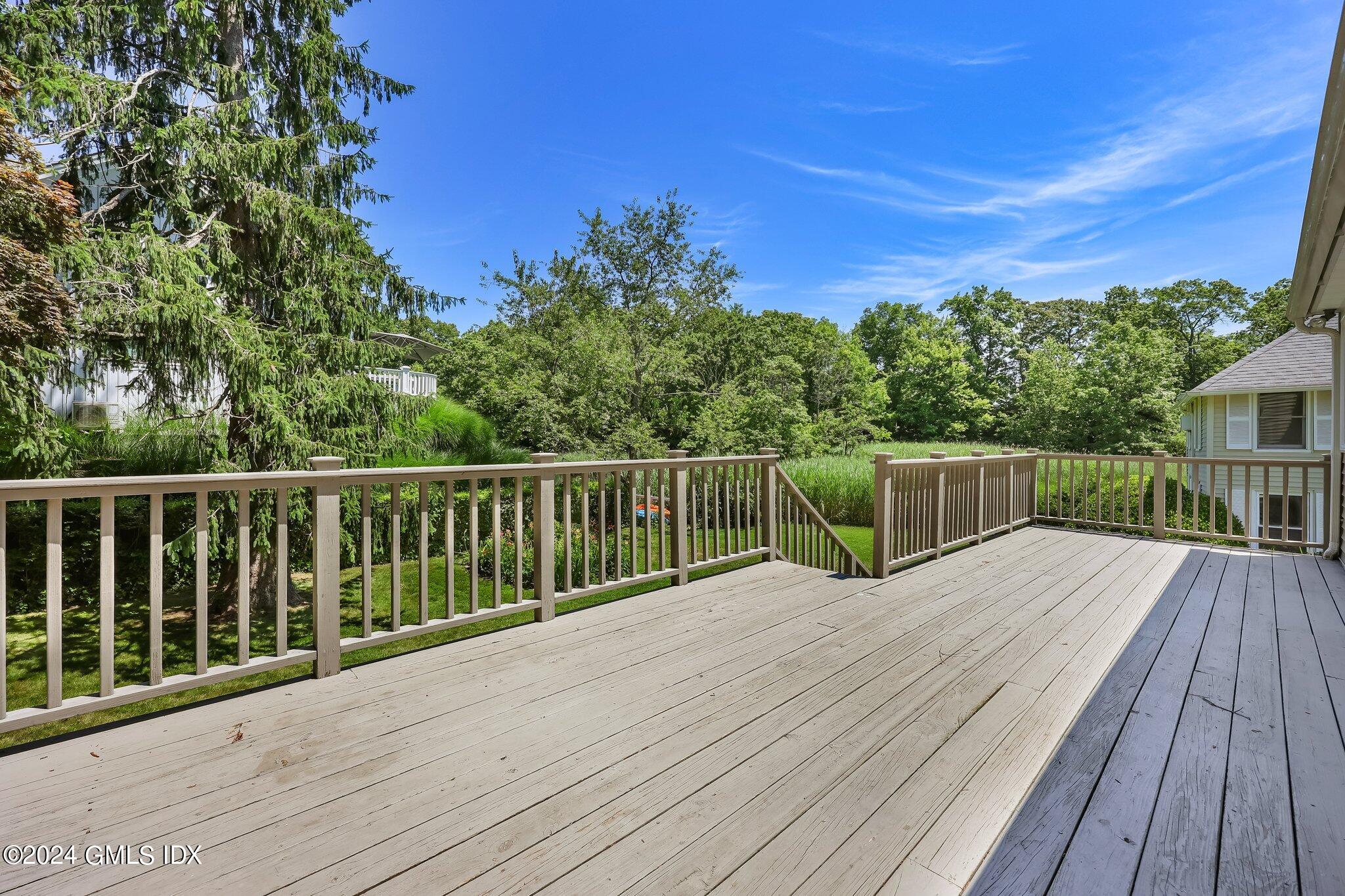 18 Shore Road Old Greenwich, CT 06870 - Photo 29 of 51 a view of a wooden deck and a garden