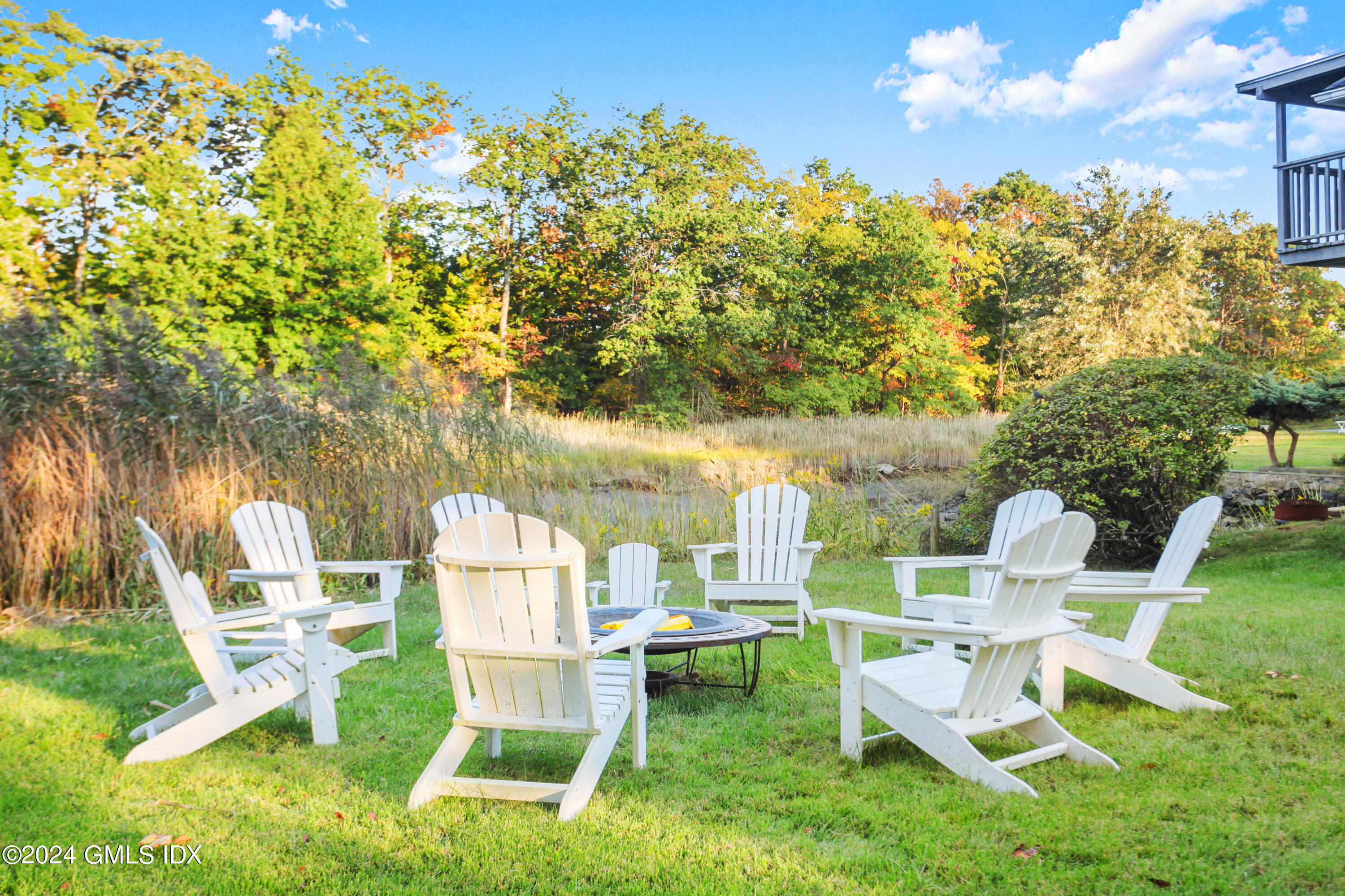 18 Shore Road Old Greenwich, CT 06870 - Photo 30 of 51 a view of yard with seating area and trees around