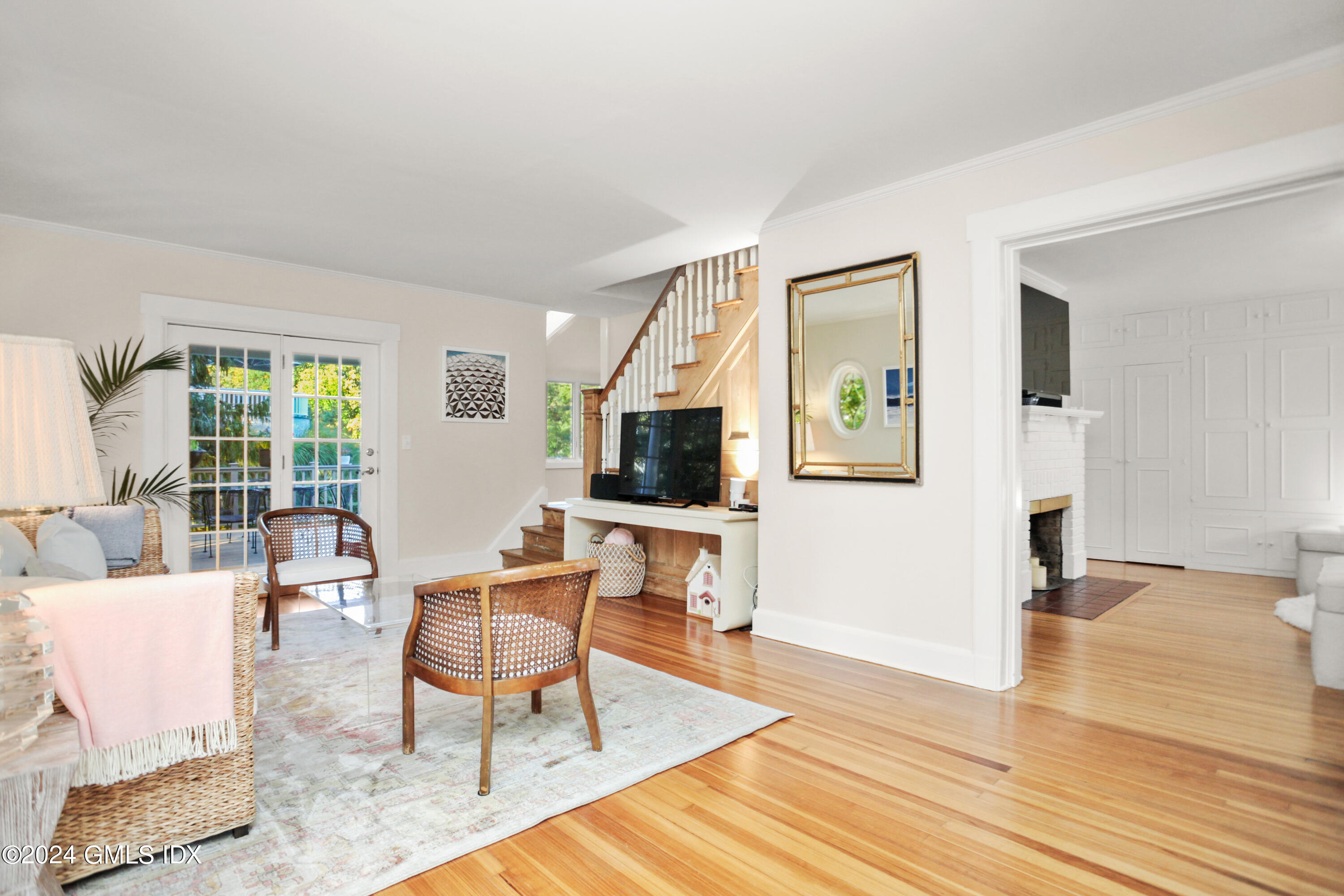 18 Shore Road Old Greenwich, CT 06870 - Photo 3 of 51 a living room with furniture and a flat screen tv