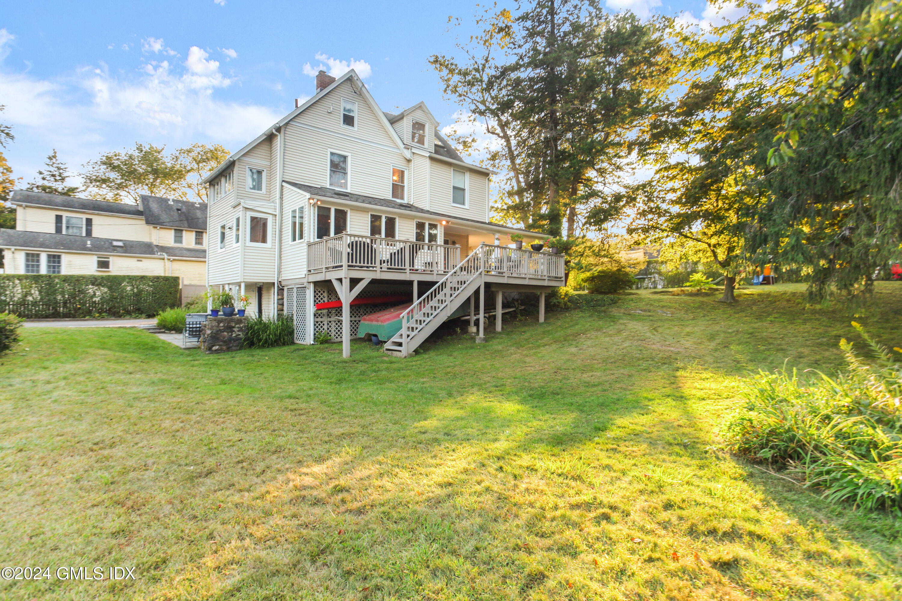 18 Shore Road Old Greenwich, CT 06870 - Photo 31 of 51 a view of house with a big yard and large trees