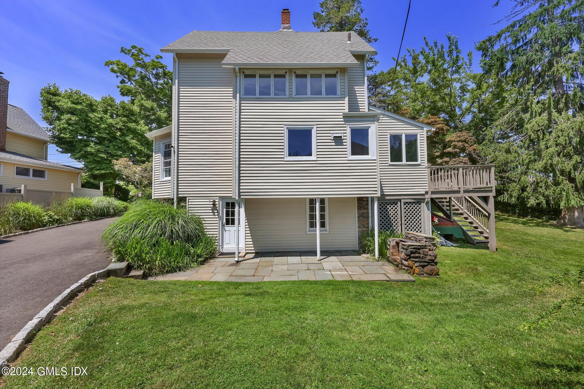 18 Shore Road Old Greenwich, CT 06870 - Photo 32 of 51 a view of a house with a yard