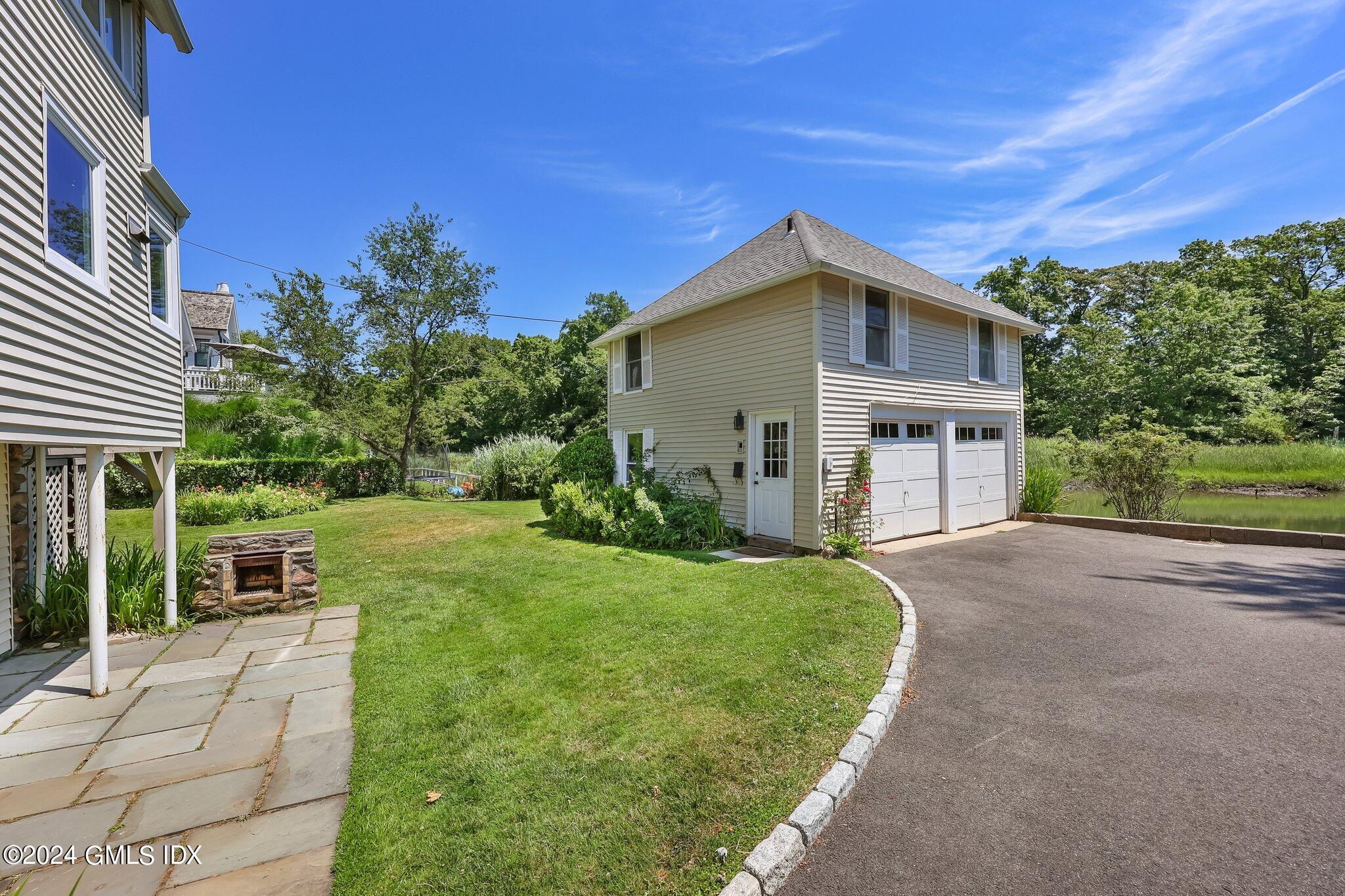 18 Shore Road Old Greenwich, CT 06870 - Photo 33 of 51 a view of a house with a yard