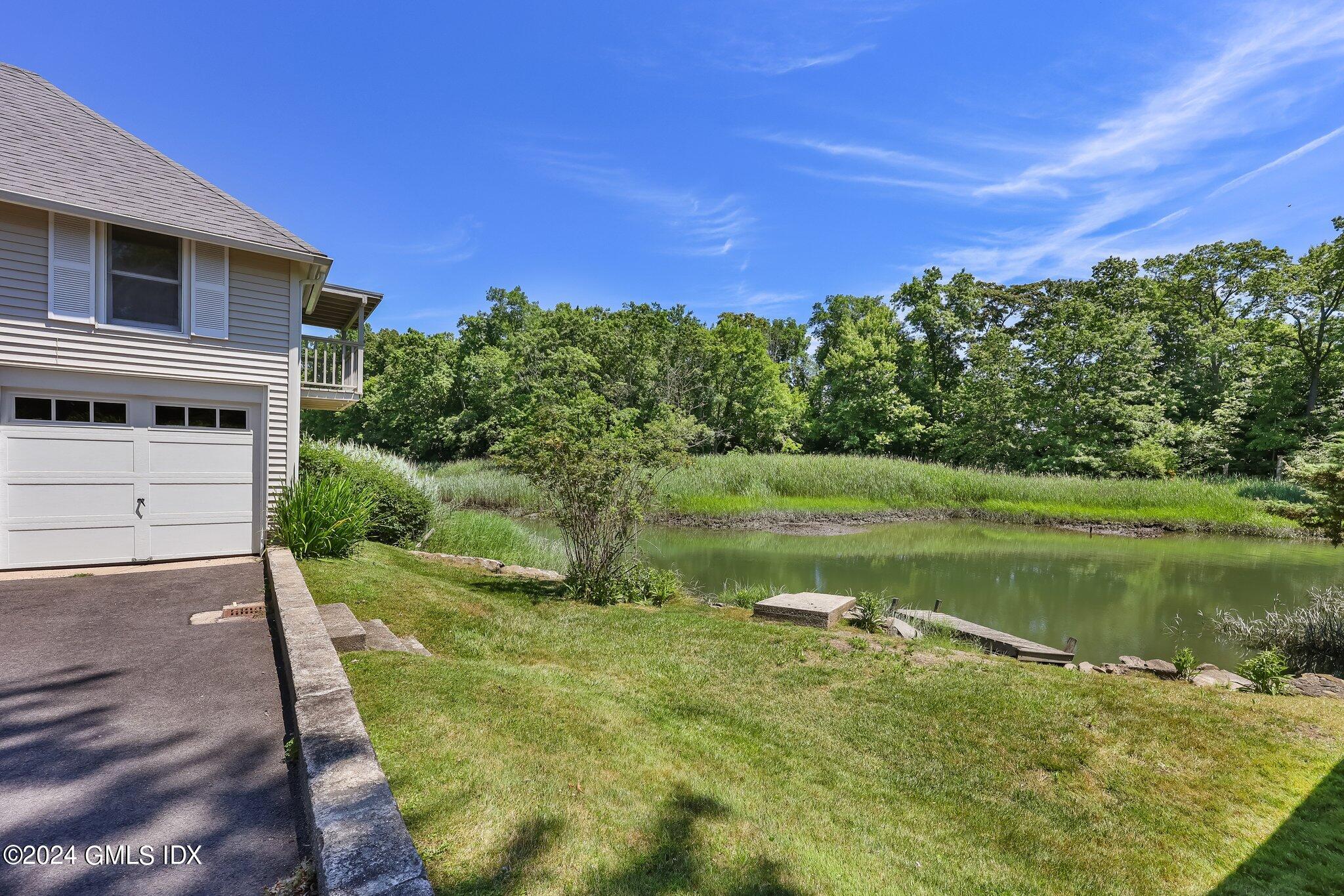 18 Shore Road Old Greenwich, CT 06870 - Photo 35 of 51 a view of a lake with a building in the background