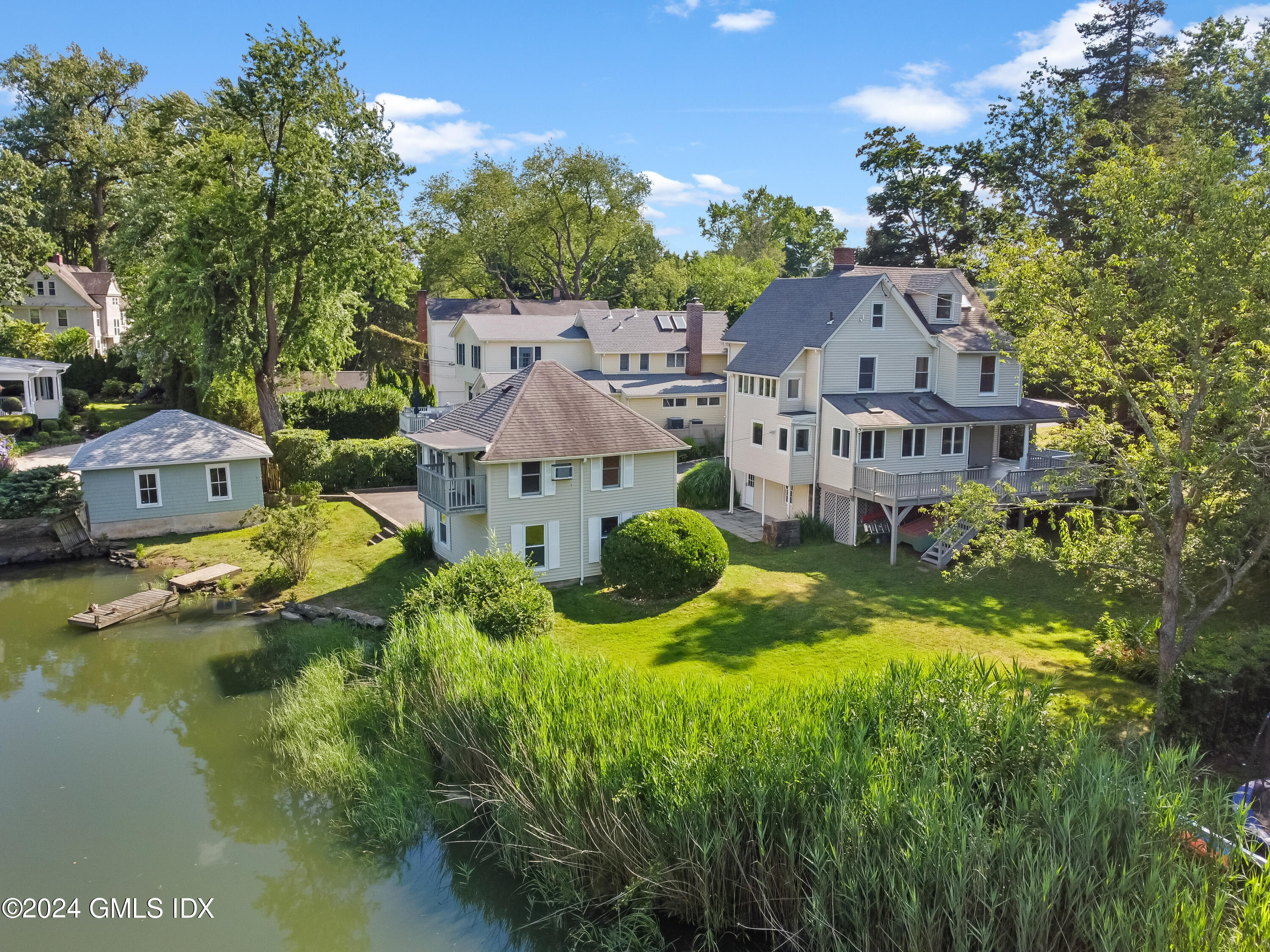 18 Shore Road Old Greenwich, CT 06870 - Photo 41 of 51 a aerial view of a house with swimming pool and garden