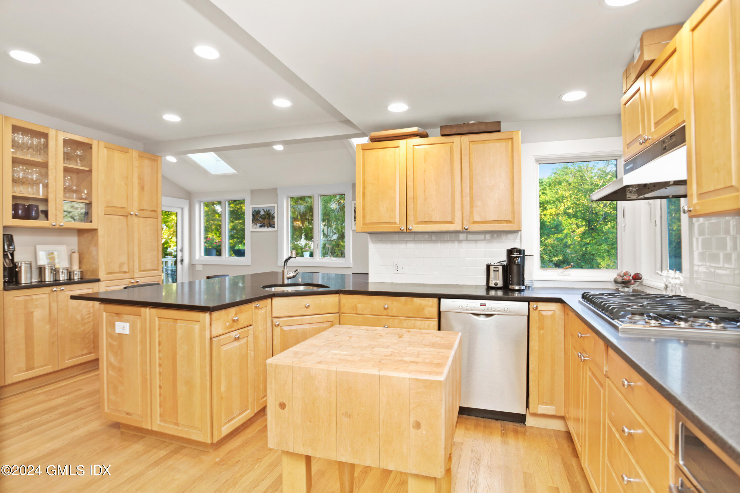 18 Shore Road Old Greenwich, CT 06870 - Photo 8 of 51 a large kitchen with granite countertop a sink and cabinets